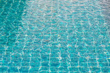 blue swimming pool with sunny reflections