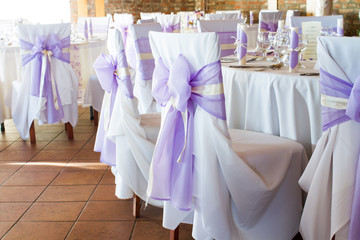 Fototapeta na wymiar wedding chairs with ribbon, event place