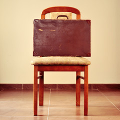 old suitcase on a chair