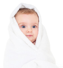 Beautiful happy baby  in a towel after bath. One, isolated on wh