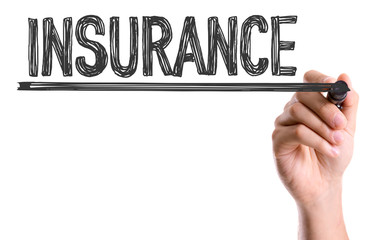 Hand with marker writing the word Insurance