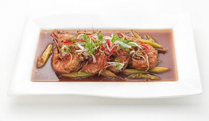 Deep-fried shrimps with hot sauce isolated on white
