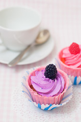 Two cupcakes and a tea cup