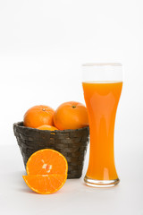 Orange juice in glass and slices orange