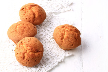 fresh homemade cupcakes on a white wooden background lace soft selective focus