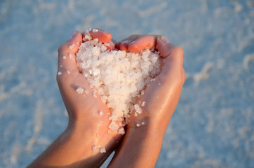 Salt crystals lying on the hand