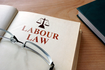 Code of labour law on a wooden table.