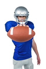 Portrait of American football player showing ball © WavebreakmediaMicro