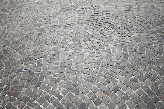 Gray cobblestone road pavement, photo texture