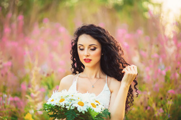 Naklejka premium Beautiful girl on the lavender field