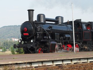 Fototapeta premium Black steam locomotive in motion.