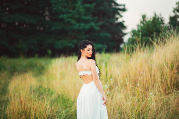 Fototapeta na wymiar beautiful pregnant woman in white dress