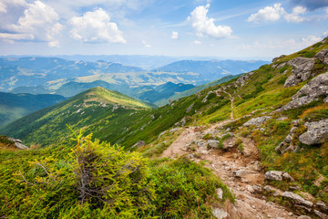 Landscape with Carpathian mountains track and sky clouds