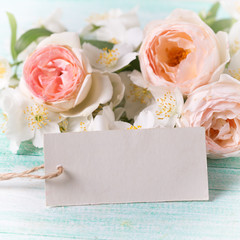 Roses, jasmine flowers and empty tag