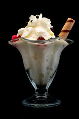 ice cream in a beautiful glass on a black background