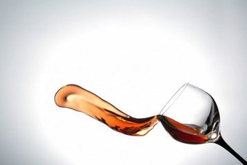 stream of wine being poured into a glass