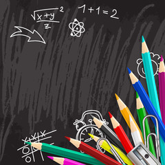Chalkboard school background with colorful pencils