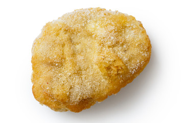 Single frozen battered chicken nugget uncooked and isolated on w