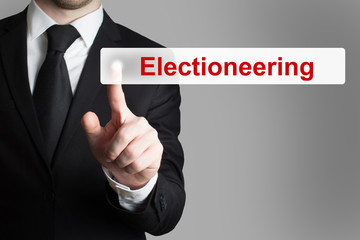 businessman pushing flat touchscreen button electioneering