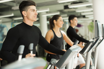 Fototapeta premium Young people training in the gym