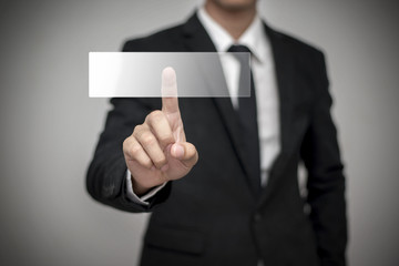 Close up of businessman touching digital screen with finger