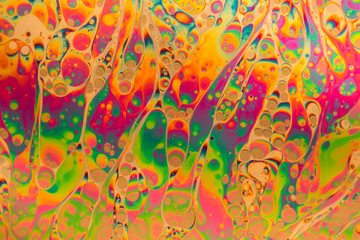 Multicolored soap bubble abstract background formed by light reflecting off the surface of a soap film