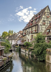 Fototapeta na wymiar Colorful traditional french houses on the side of river Lauch in Petite Venise, Colmar, France