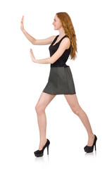 Red hair girl in gray dress isolated on white