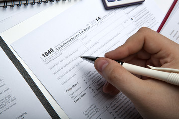 filling tax return on desktop