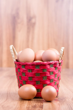 egg in a basket  on wodden table