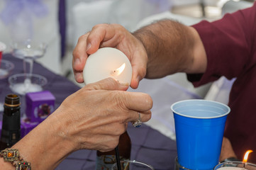 Helping hands unit to light the candle.