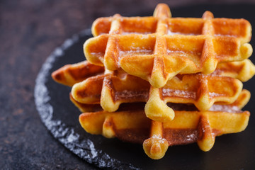 Belgian waffles  on a black background.