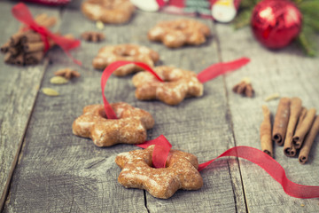 Honey cakes with spices on a wooden background. Christmas compos