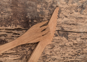 bamboo fork and knife on wooden table