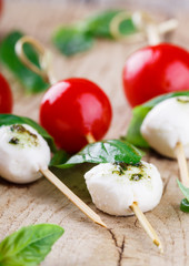 Cherry tomatoes,mozzarella and Basil on skewers. Appetizer,Caprese.selective focus