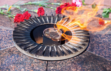 Eternal flame and flowers in memory of the Victory in the Great