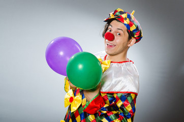 Clown with balloons in funny concept