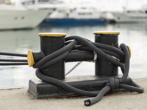 Bollard on a wharf, to which a ship's rope may be secured.