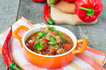 Chashushuli - spicy meat stew with vegetables. Georgian dishes.