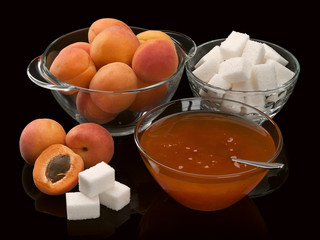 Apricots, jam, sugar in glasswares