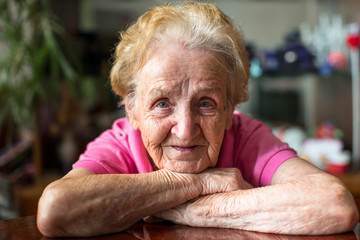 Closeup portrait of happy elderly woman.