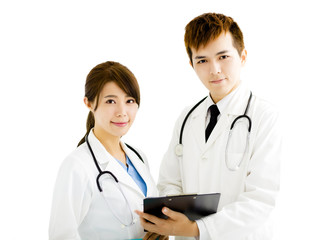 Fototapeta premium smiling male and female doctors standing together
