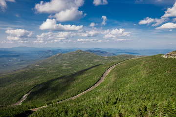 Winding road in Adirondack mountains, upstate New York, USA. Transportation, travel, explore, vacation, summer, destination, driving and nature concept