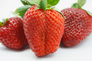 Red juicy wet strawberries closeup