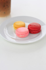 Sweet and colourful french macarons on white table