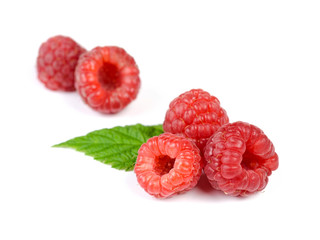 Heap of Juicy Red Ripe Raspberry with Green Leaves, Isolated