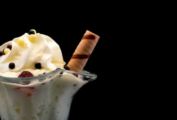 ice cream in a beautiful glass on a black background