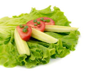 fresh vegetables on a salad leaf isolated on a white background
