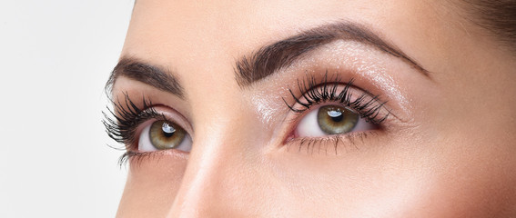 Closeup shot of woman eye with day makeup. Long eyelashes - 91041603