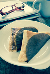 Pie triangular shape on white dish,vintage effect filter